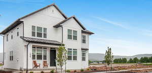 View of front of house with a mountain view