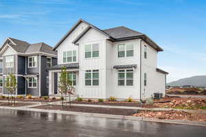 View of front of house with a mountain view and central AC