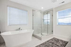 Bathroom with plus walk in shower