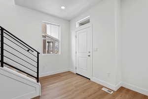 Foyer entrance featuring light hardwood / wood-style flooring