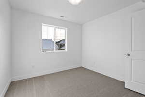 Empty room featuring carpet