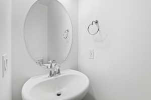 Bathroom featuring sink and toilet