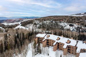 Snowy aerial view with a mountain view