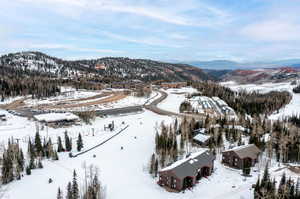 Snowy aerial view with a mountain view