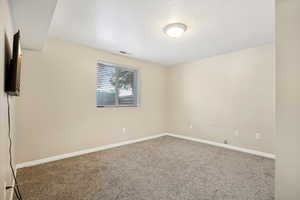 Empty room with carpet floors