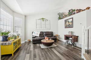 Living room with wood-type flooring