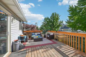 Wooden deck with an outdoor living space