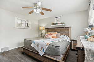 Bedroom featuring dark hardwood / wood-style floors and ceiling fan