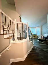 Stairway with hardwood / wood-style flooring