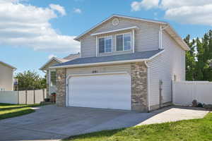 View of front of property with a garage