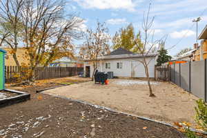 Back of property featuring cooling unit