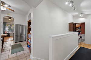 Interior space with light tile patterned floors and a textured ceiling