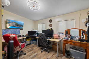 Office area featuring hardwood / wood-style floors and a textured ceiling - 2nd bedroom