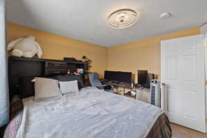 Bedroom with a textured ceiling and hardwood / wood-style flooring - 3rd bedroom