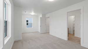 Carpeted empty room with plenty of natural light