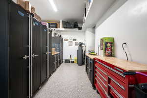 Kitchen featuring light colored carpet and wood counters