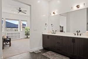 Bathroom with tile patterned flooring, vanity, and ceiling fan