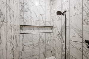 Bathroom featuring tiled shower