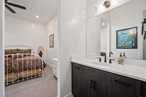 Bathroom with vanity and ceiling fan