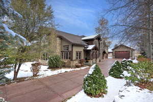 Craftsman-style home featuring an outbuilding and a garage