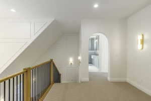 Bonus room with light colored carpet