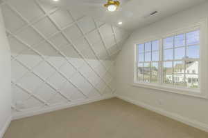 Bonus room featuring carpet and a healthy amount of sunlight