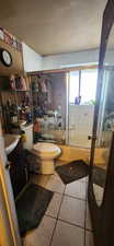 Bathroom with tile patterned flooring, vanity, and toilet