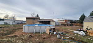 View of yard with a fenced in pool