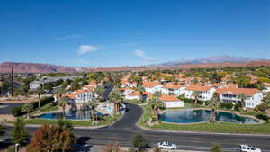 Birds eye view of community with a water and mountain view