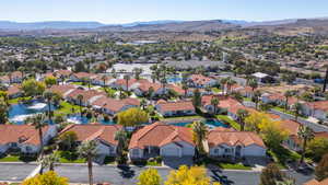 Birds eye view of property with a mountain view