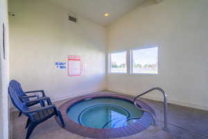 View of an indoor in-ground hot tub