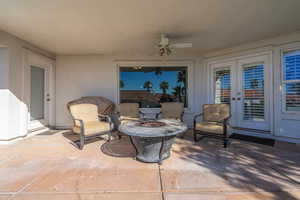 View of patio with a fire pit and ceiling fan