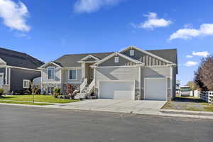 View of front facade featuring a garage