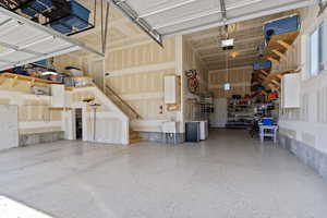 Garage featuring a garage door opener and sink