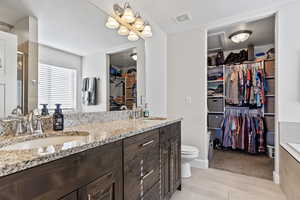 Bathroom with toilet and vanity