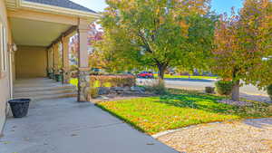 View of yard with covered porch