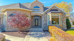 View of front of home with a balcony