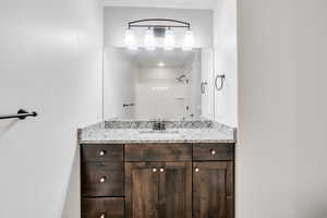 Bathroom with a shower and vanity