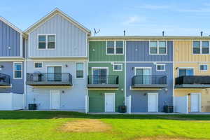 Rear view of property with a patio and balcony