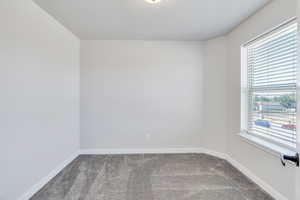 2nd Bedroom with carpet flooring lots of natural light