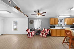 Kitchen featuring a wealth of natural light, sink, and light hardwood / wood-style flooring