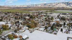 Snowy aerial view with a mountain view