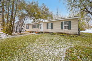 View of front of home featuring a front lawn