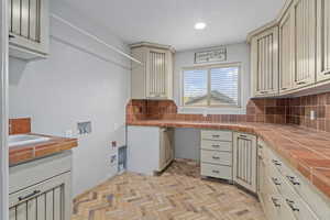 Laundry Room with sink and storage