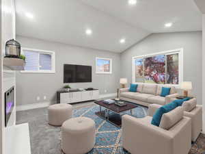 Carpeted living room with vaulted ceiling