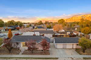 Aerial view at dusk featuring a mountain view