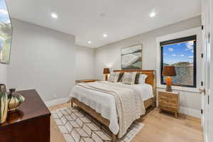 Bedroom with light hardwood / wood-style floors