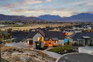 View of front of property featuring a mountain view and a garage