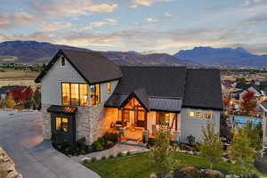 Modern farmhouse style home with a yard and a mountain view