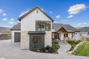 Modern farmhouse featuring a mountain view and a garage